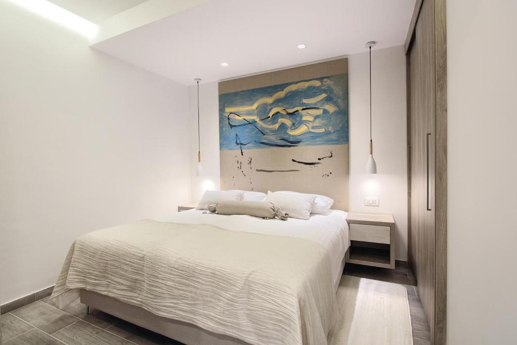 Postel nebo postele na pokoji v ubytování Kalamota Beach House