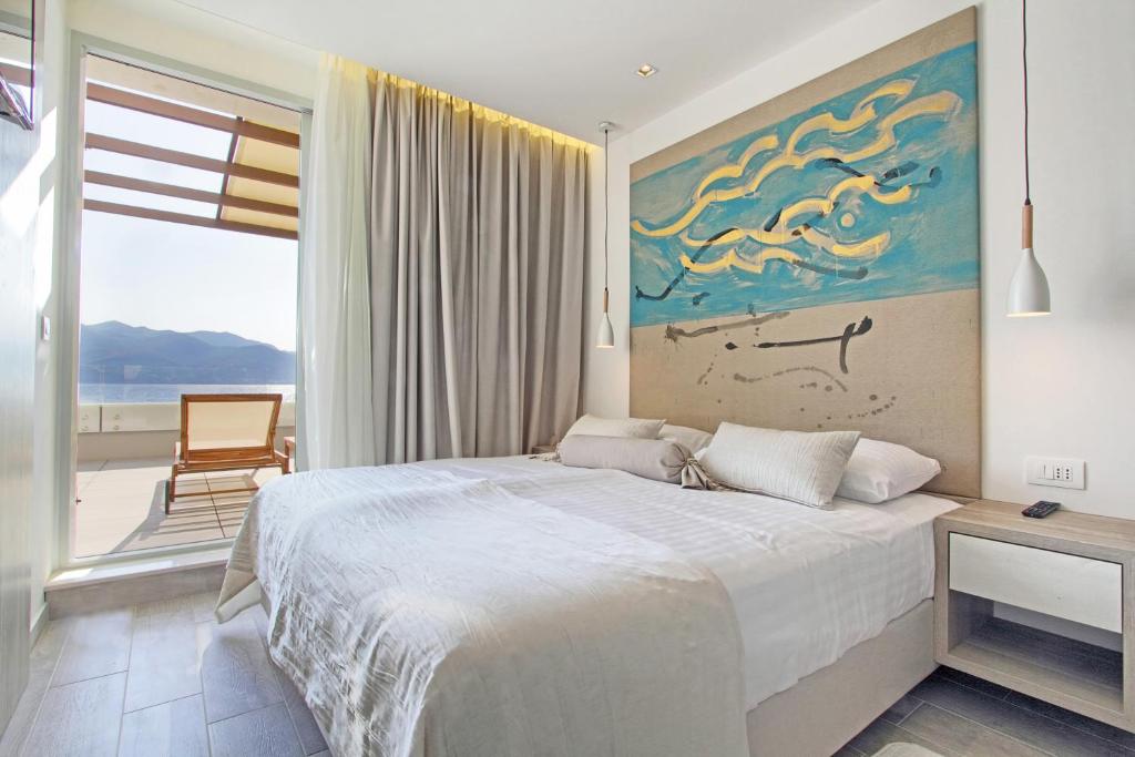 Postel nebo postele na pokoji v ubytování Kalamota Beach House