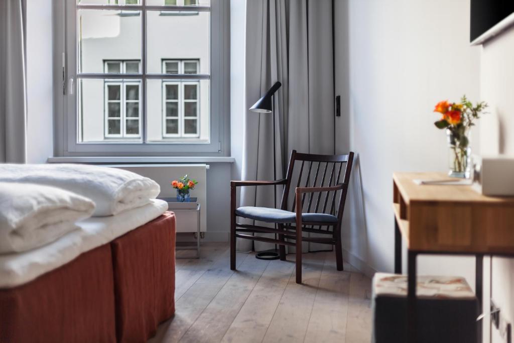 Postel nebo postele na pokoji v ubytování Hotel Die Reederin