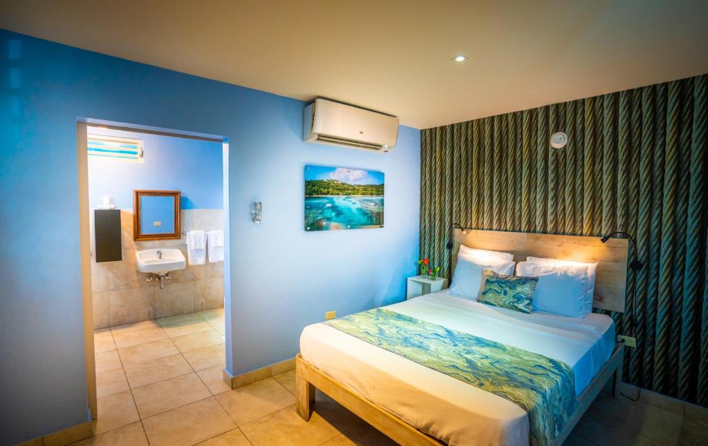 Ένα ή περισσότερα κρεβάτια σε δωμάτιο στο El Navegante de Culebra