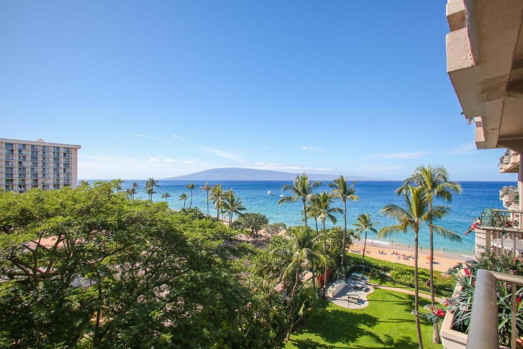 a view of the beach from the balcony of a resort at Whaler #763 Condo in Lahaina