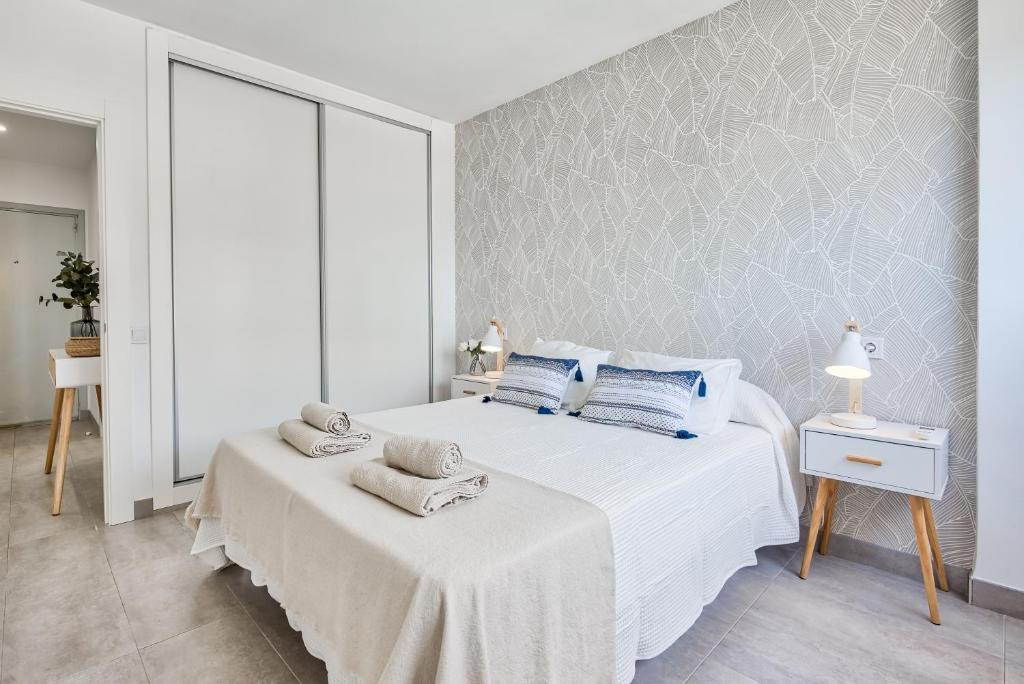 Postel nebo postele na pokoji v ubytování Sur Suites Perla 6