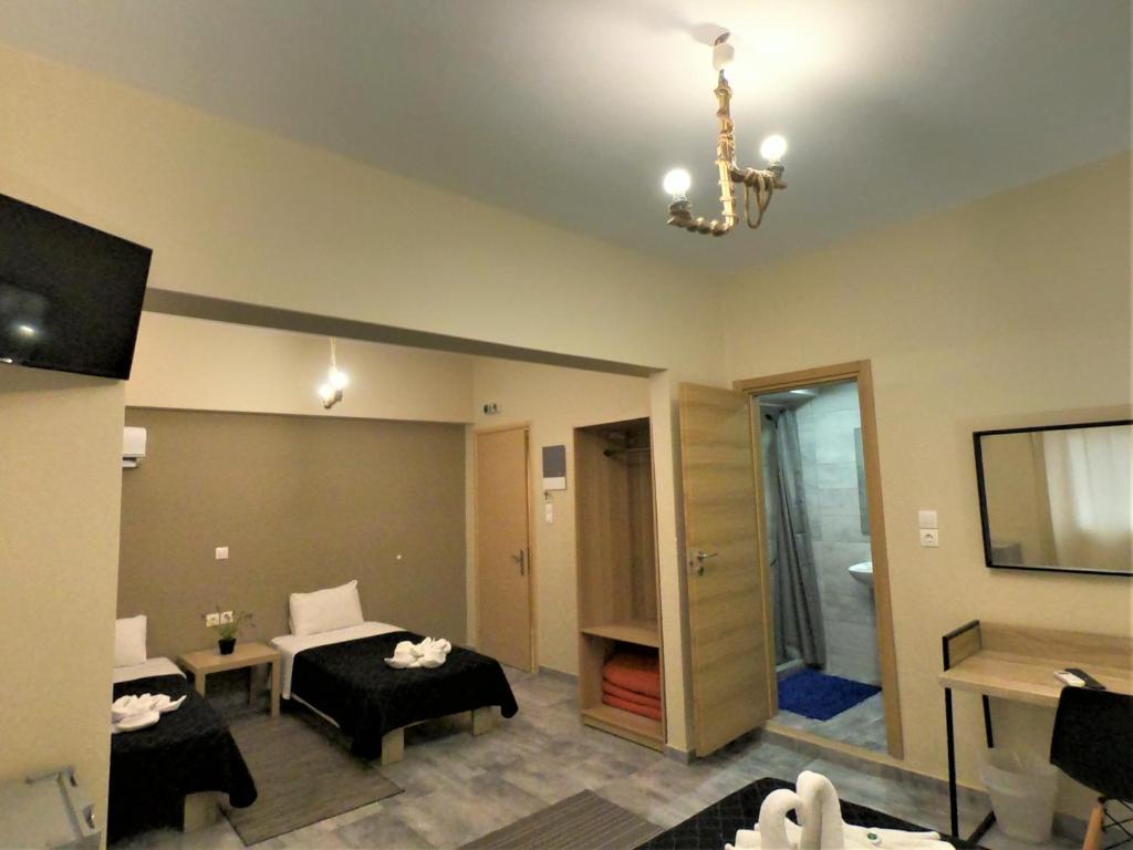 TV a/nebo společenská místnost v ubytování Achillion Hotel Piraeus