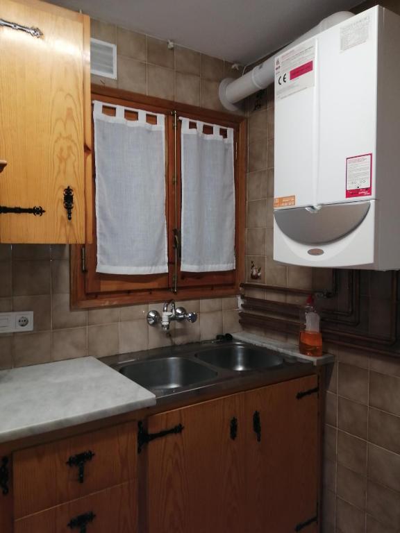 Kuchyň nebo kuchyňský kout v ubytování APARTMENT NATURA