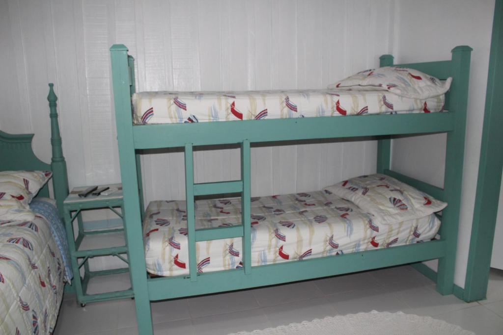 Cama ou camas em um quarto em Pousada Canto da Galheta