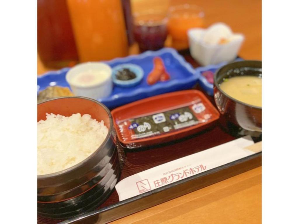 a table with some rice and bowls of food at Shobara Grand Hotel - Vacation STAY 06902v in Shōbara