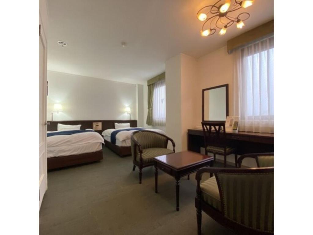 Postel nebo postele na pokoji v ubytování Shobara Grand Hotel - Vacation STAY 06885v