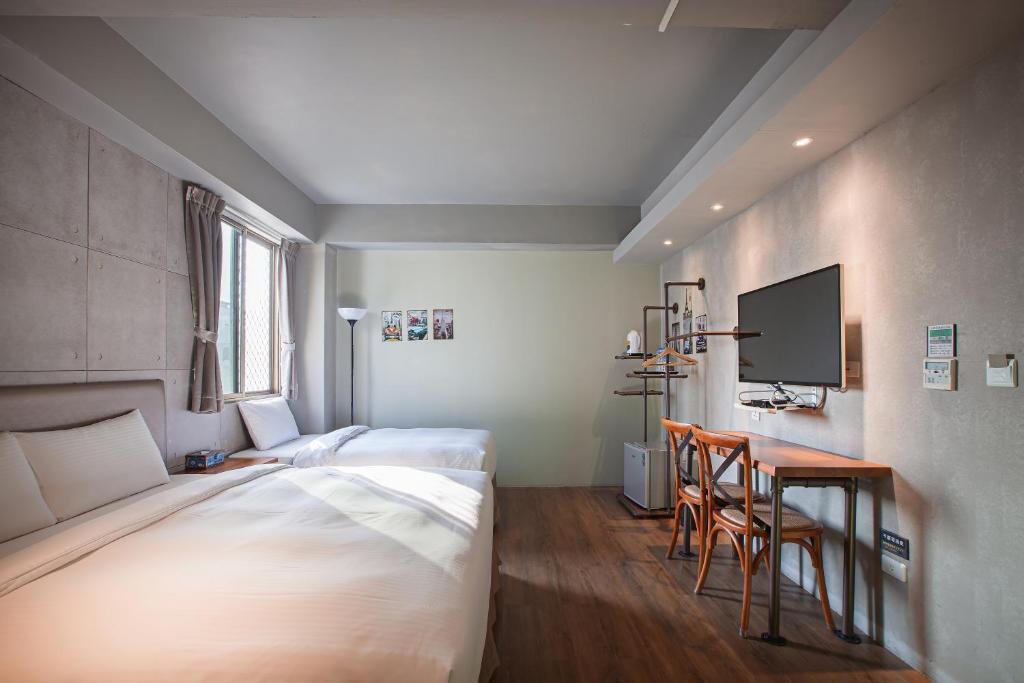 Postel nebo postele na pokoji v ubytování Tourism Inn