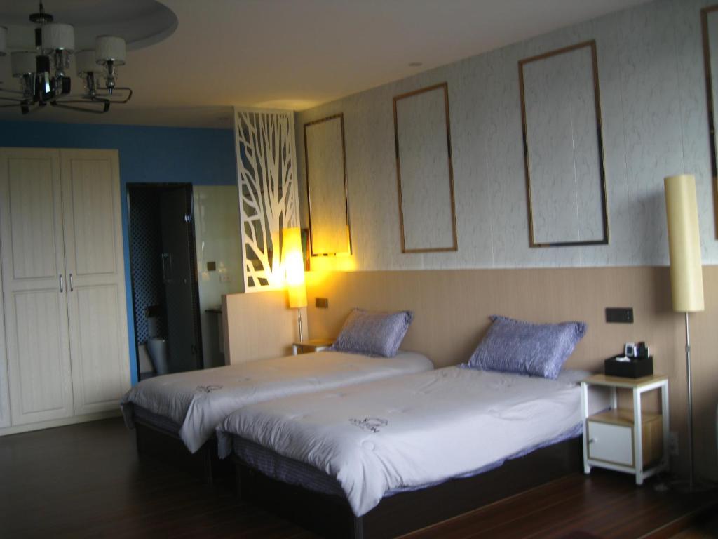 Voodi või voodid majutusasutuse Jiji Wu Homestay toas