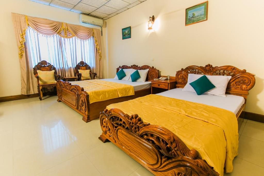 Postel nebo postele na pokoji v ubytování Star Hotel