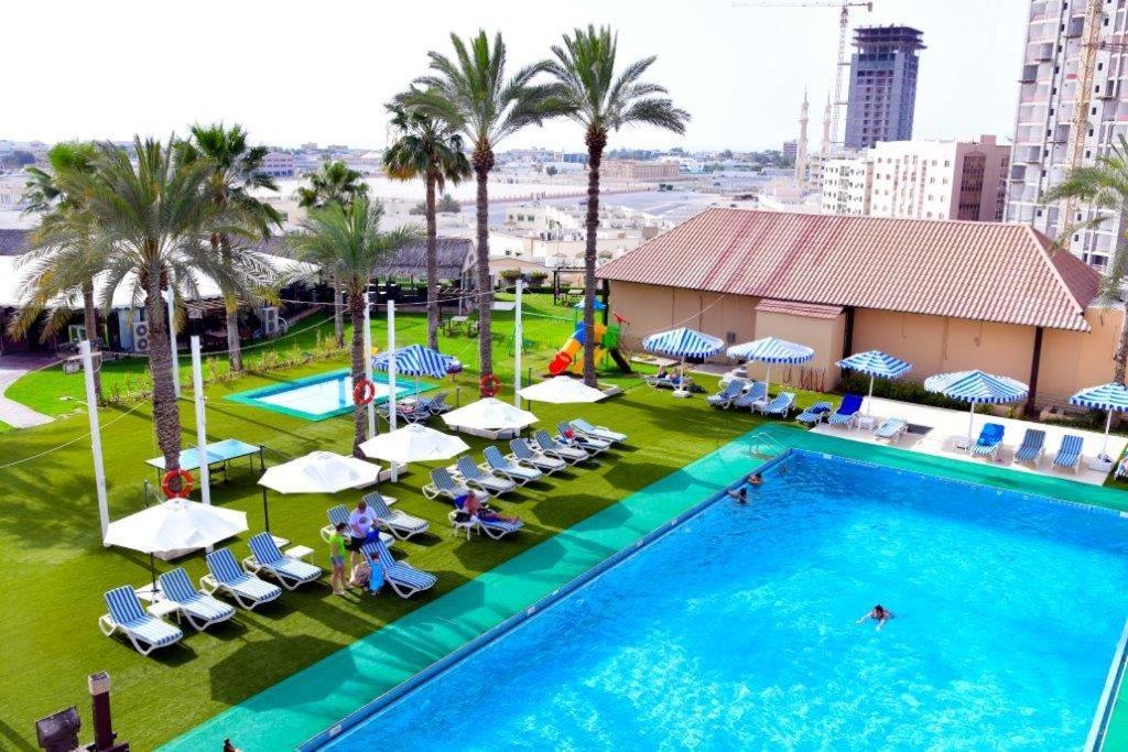 an overhead view of a swimming pool at a hotel at Ras Al Khaimah Hotel in Ras al Khaimah