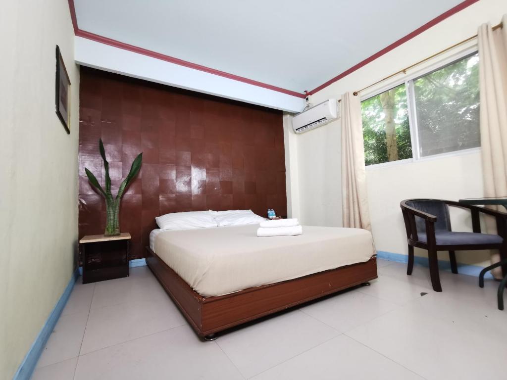 Postel nebo postele na pokoji v ubytování Cebu Hilltop Hotel