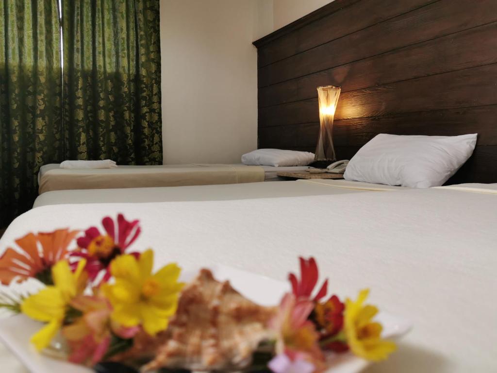 Postel nebo postele na pokoji v ubytování Cebu Hilltop Hotel