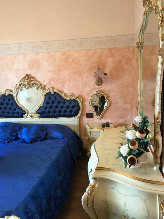 Postel nebo postele na pokoji v ubytování Le Rose
