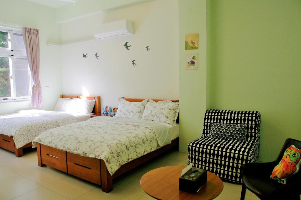 Postel nebo postele na pokoji v ubytování Yanzitao Pottery Coffee B&B