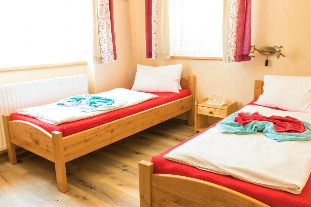 Postel nebo postele na pokoji v ubytování Pension U Pece