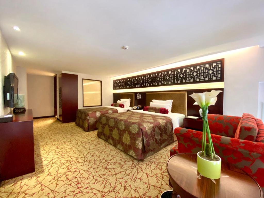 Postel nebo postele na pokoji v ubytování Hotel Metropole