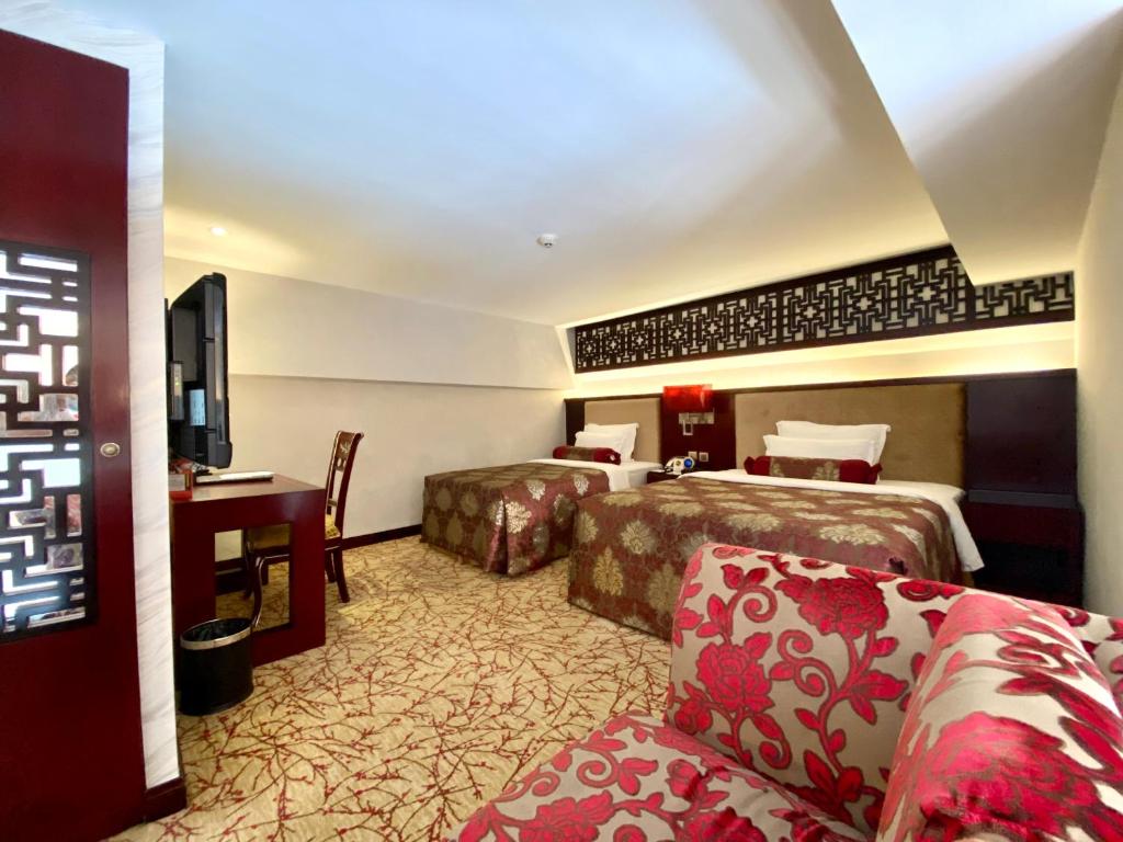 Postel nebo postele na pokoji v ubytování Hotel Metropole