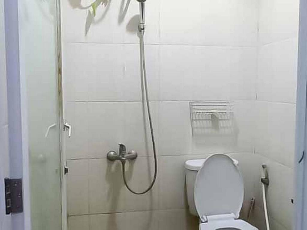Koupelna v ubytování Aimer Guest House Syariah Mitra RedDoorz