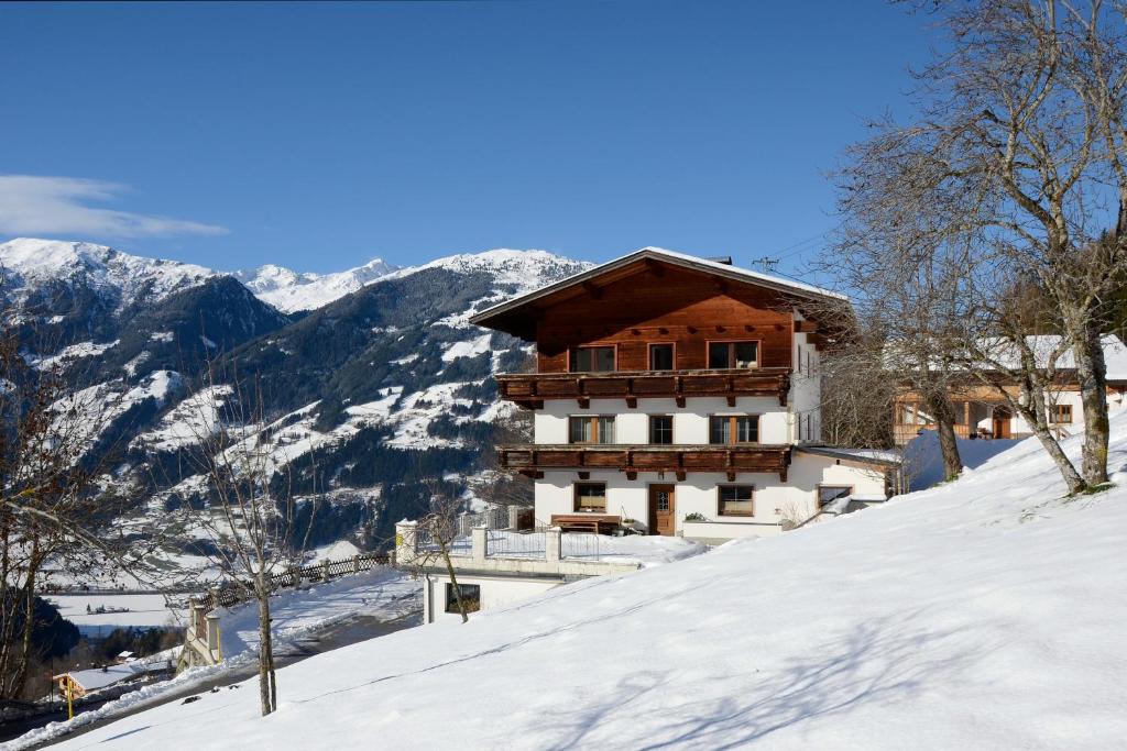 a building on top of a snow covered mountain at Haus Panorama in Gerlosberg