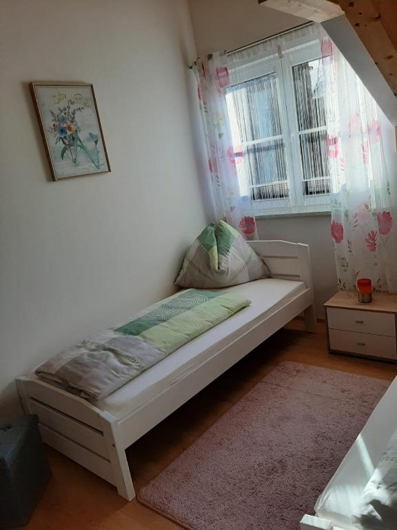 A bed or beds in a room at Ferienwohnung Christine