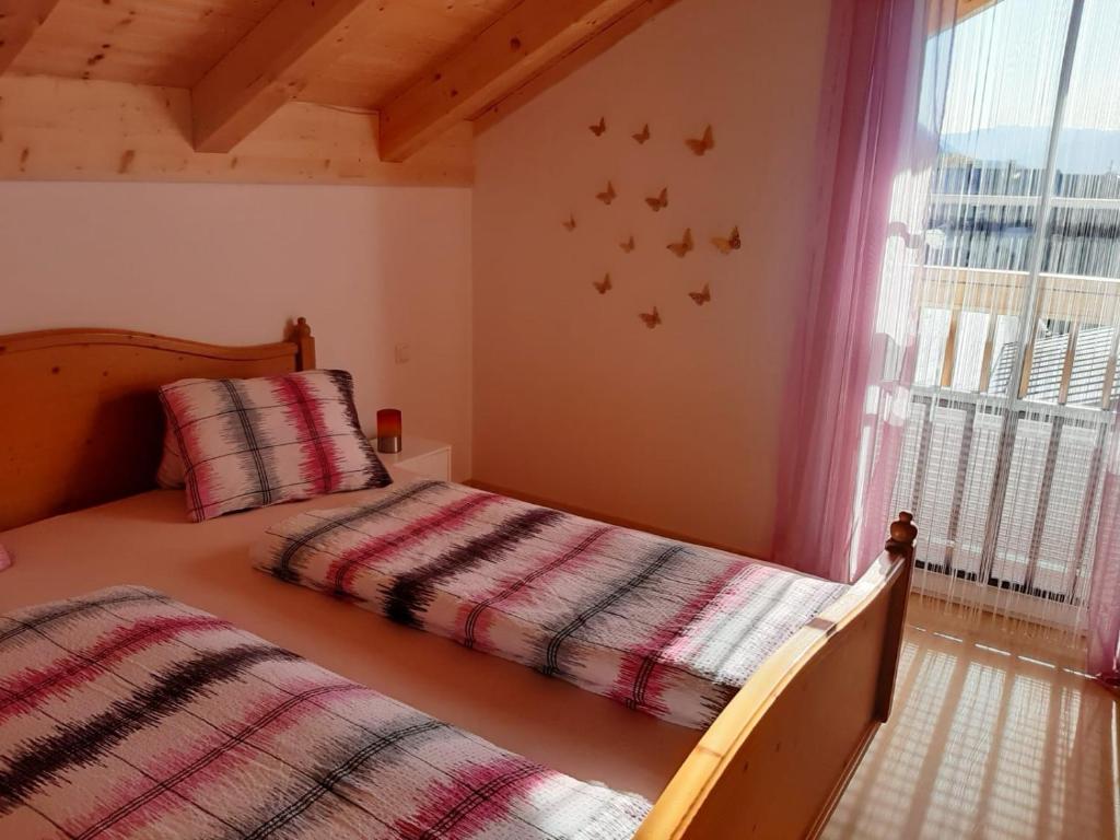 A bed or beds in a room at Ferienwohnung Christine