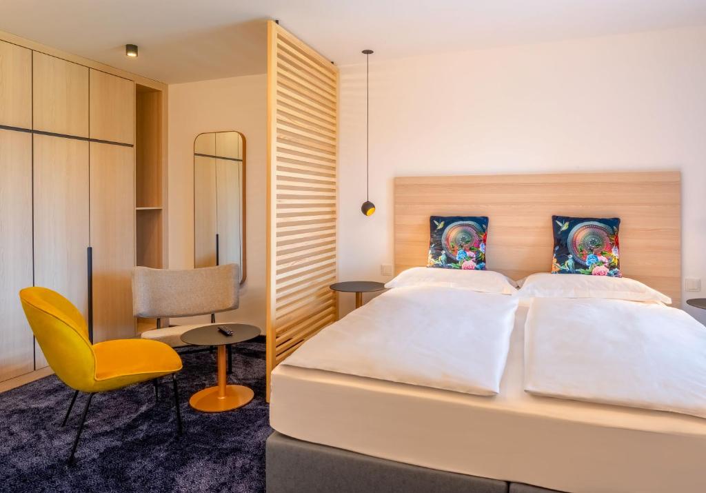 Postel nebo postele na pokoji v ubytování Hotel Bei Gretel, Wellness & Ayurveda