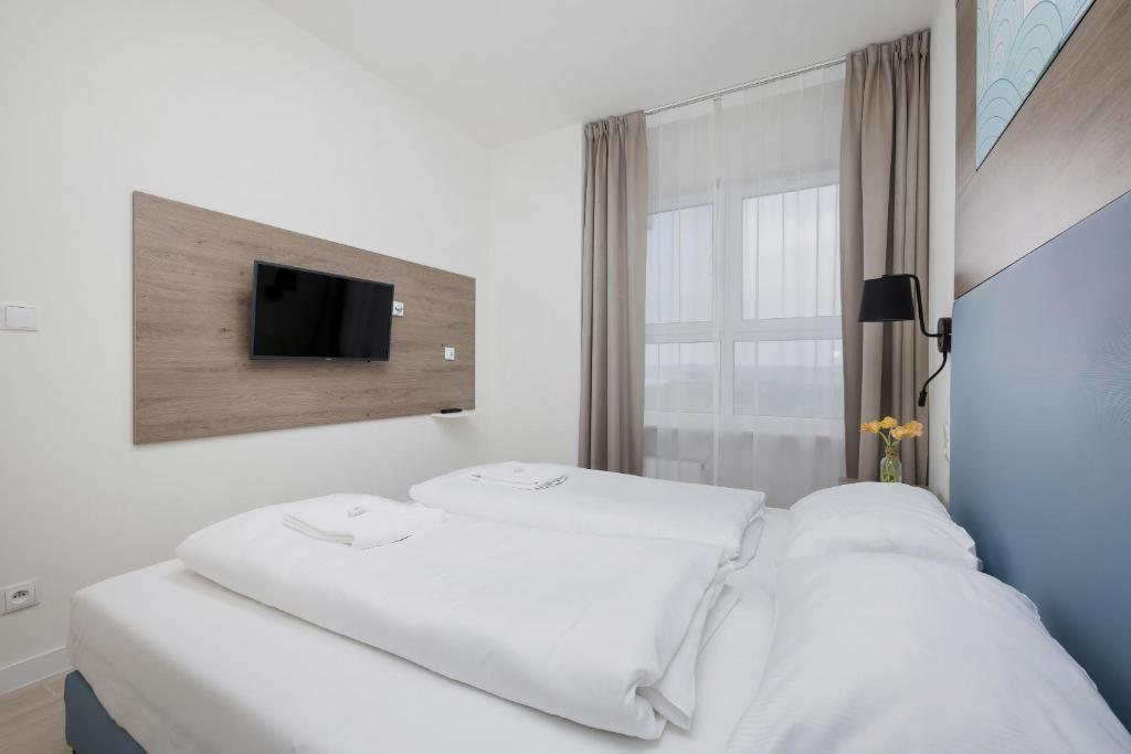 Posteľ alebo postele v izbe v ubytovaní Apartamenty Aquamarina Onyx by Noclegi Renters