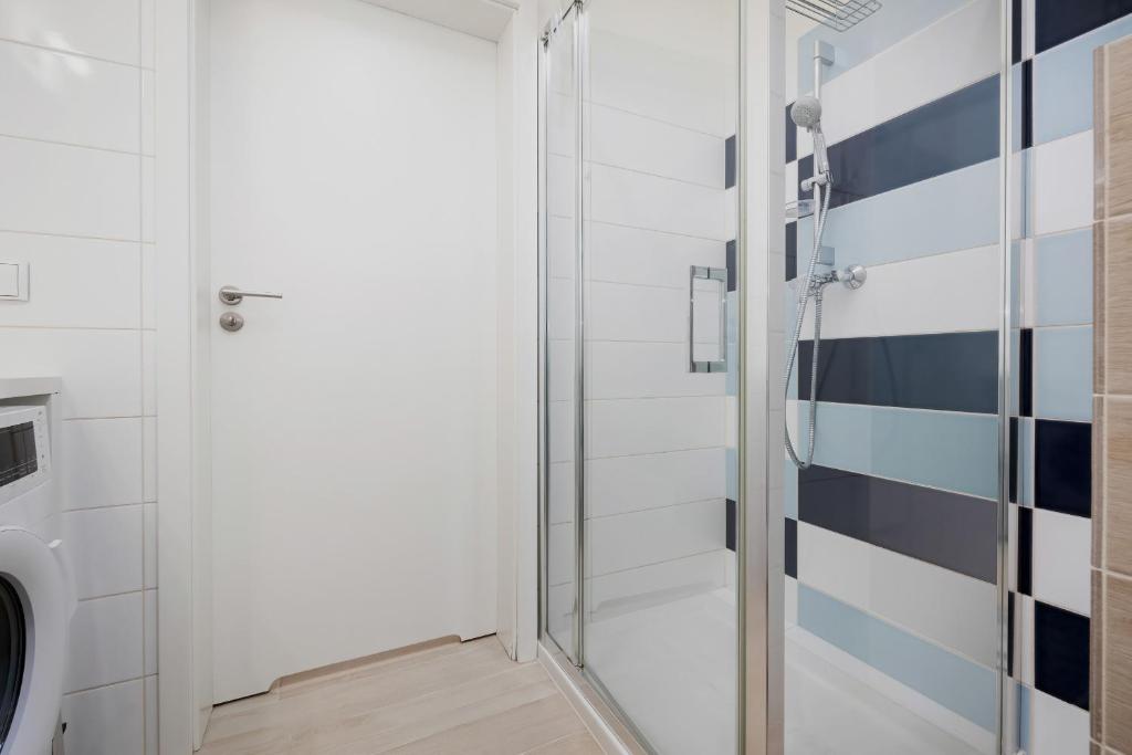 Kúpeľňa v ubytovaní Apartamenty Aquamarina Onyx by Noclegi Renters
