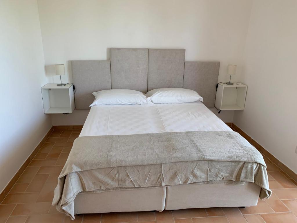 Łóżko lub łóżka w pokoju w obiekcie casa paola