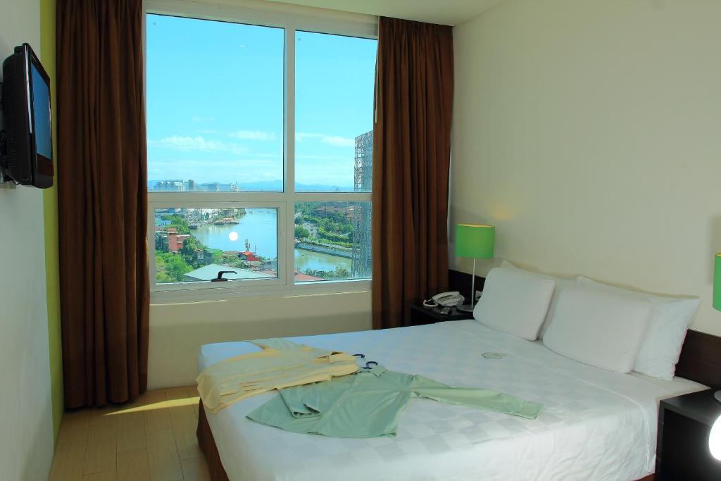Postel nebo postele na pokoji v ubytování Go Hotels Plus Mandaluyong