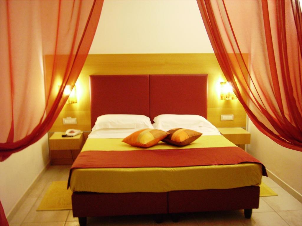 Postel nebo postele na pokoji v ubytování Hotel Degli Haethey