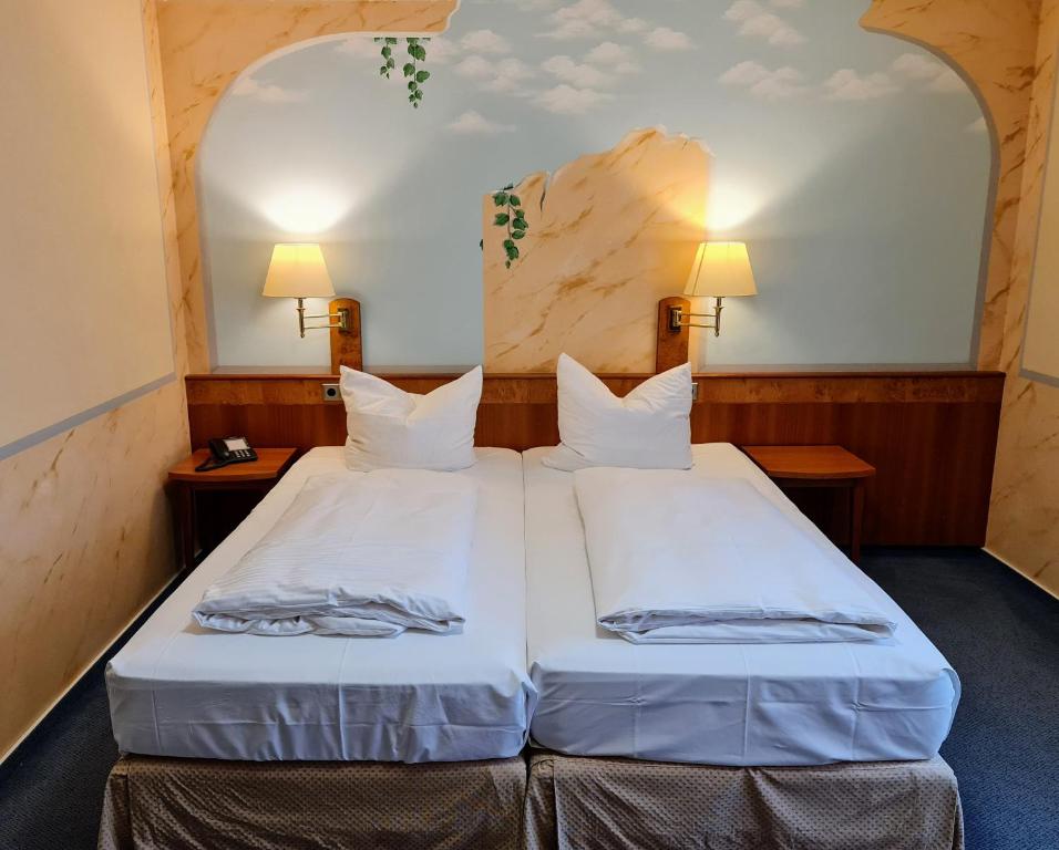 Postel nebo postele na pokoji v ubytování Hotel Restaurant Felix