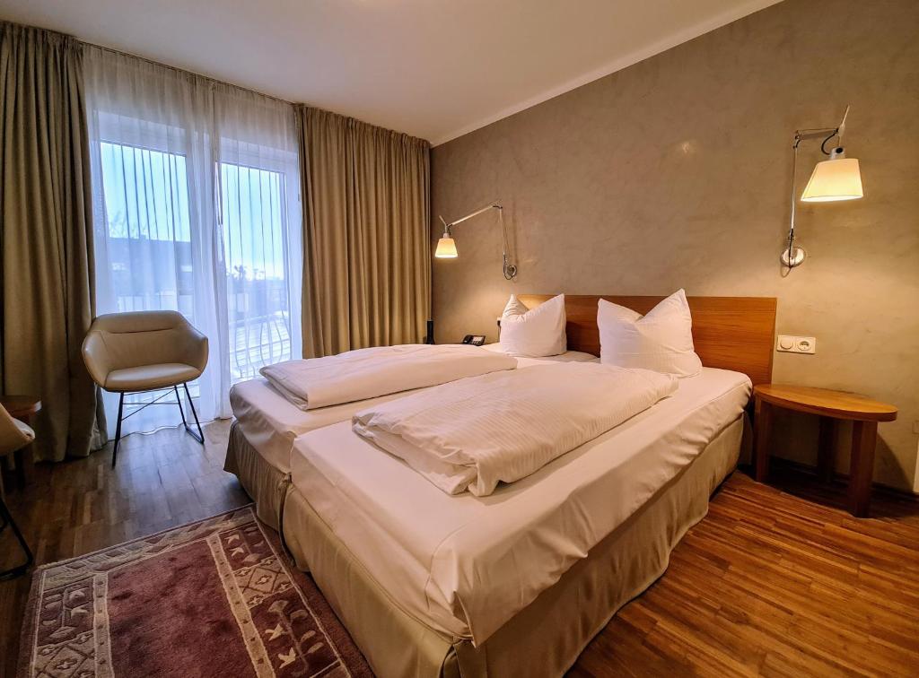 Postel nebo postele na pokoji v ubytování Hotel Restaurant Felix