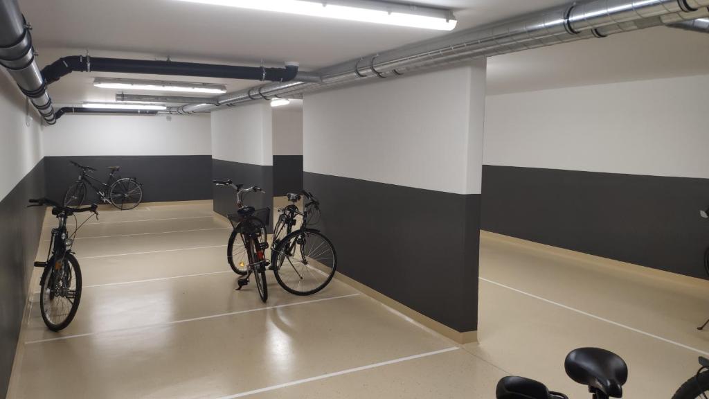 two bikes in a room with black and white walls at Apartment "SUN" in Friedrichshafen
