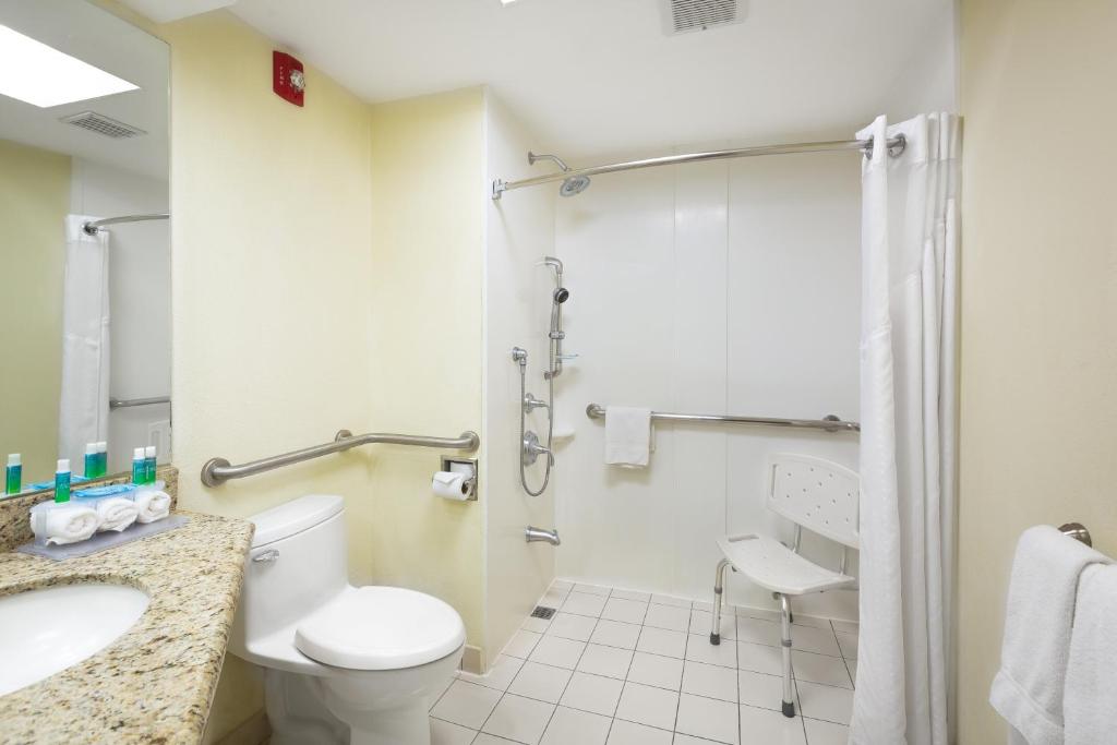 a bathroom with a toilet and a sink and a shower at Holiday Inn Express San Jose Costa Rica Airport by IHG in Alajuela City
