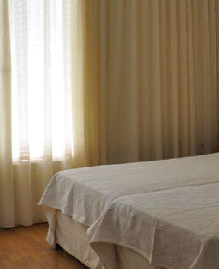 Postel nebo postele na pokoji v ubytování Miami Hotel