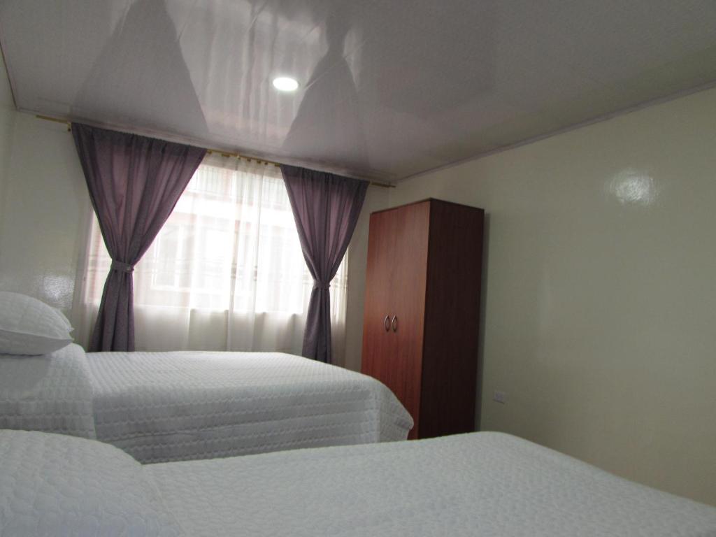Postel nebo postele na pokoji v ubytování Touristic House