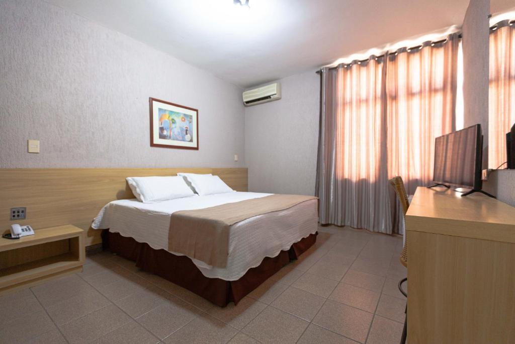Postel nebo postele na pokoji v ubytování Hotel Foz do Iguaçu