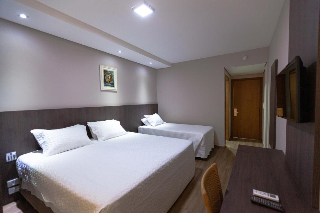 Postel nebo postele na pokoji v ubytování Hotel Foz do Iguaçu