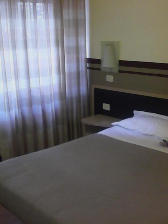 Postel nebo postele na pokoji v ubytování Hotel La Fonte