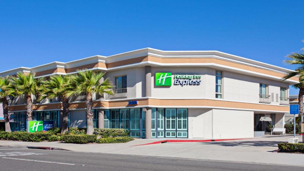 a large building with a sign on the side of it at Holiday Inn Express Newport Beach, an IHG Hotel in Newport Beach