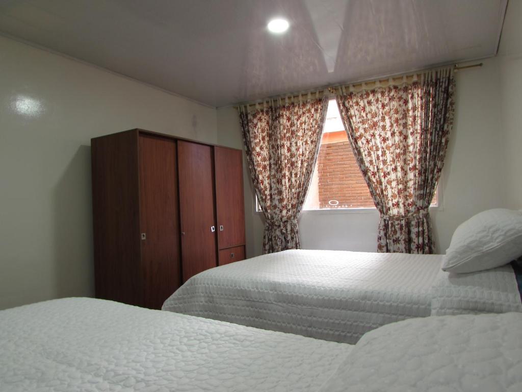 Postel nebo postele na pokoji v ubytování Touristic House