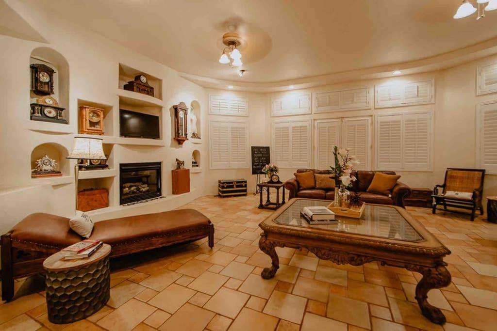 a living room with a couch and a coffee table at Hacienda del Avion in Bisbee