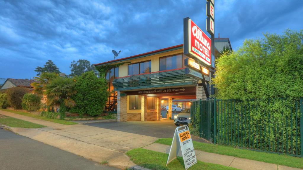 a store with a sign in front of it at Alluna Motel in Armidale