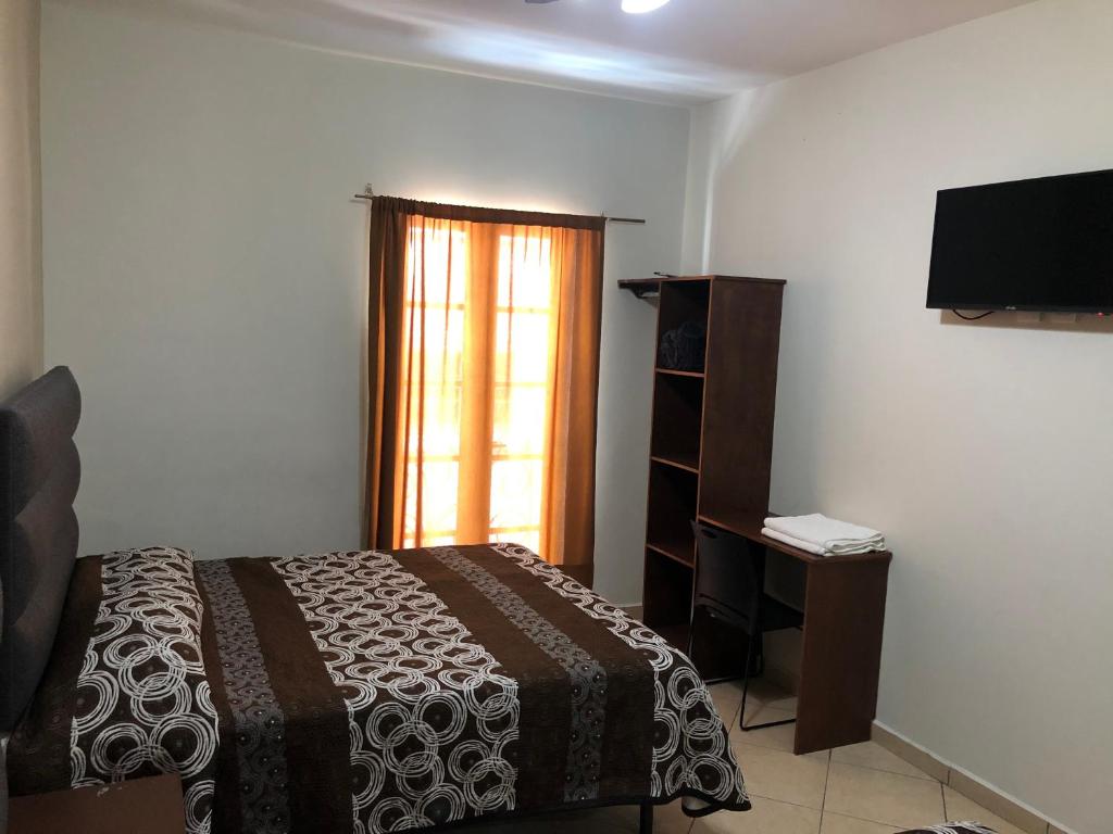 Postel nebo postele na pokoji v ubytování Hotel Posada Ruiseñor