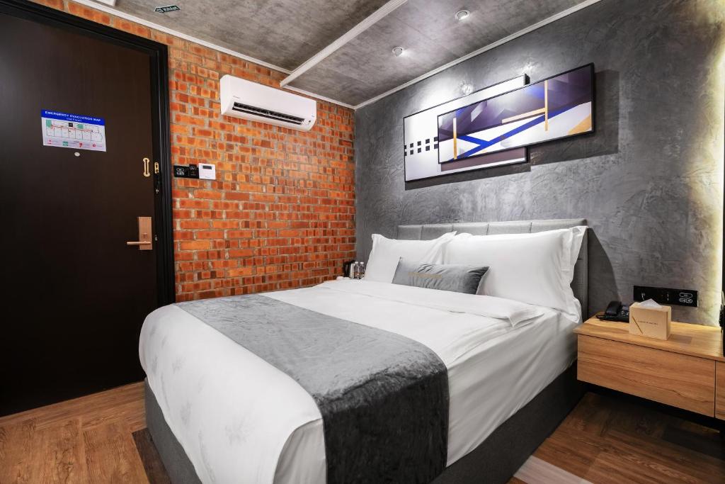 Postel nebo postele na pokoji v ubytování A&R Urban Hotel
