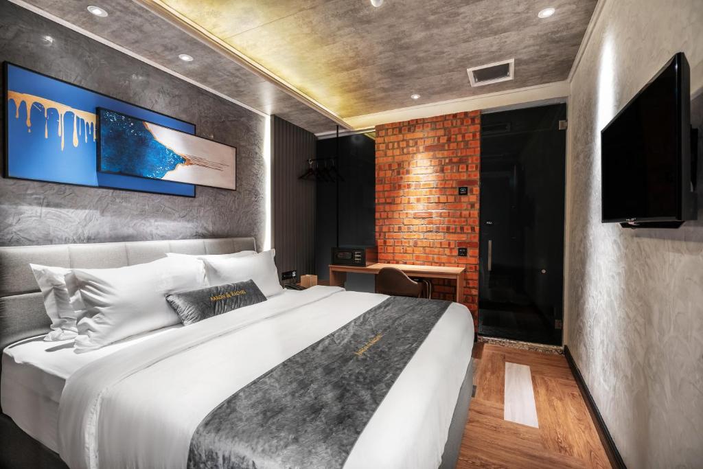 Postel nebo postele na pokoji v ubytování A&R Urban Hotel
