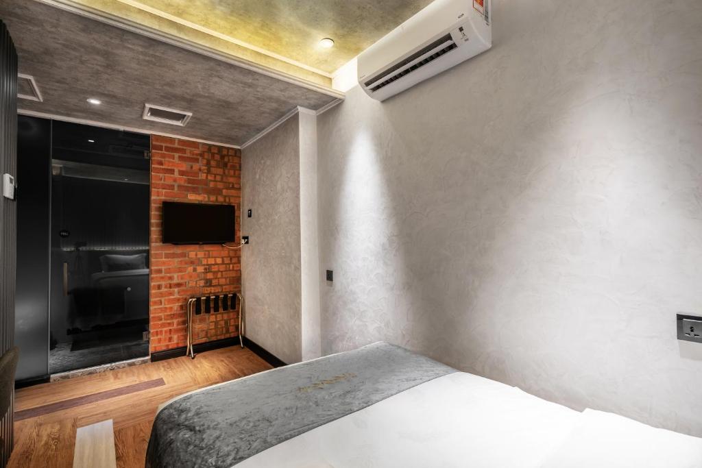 Postel nebo postele na pokoji v ubytování A&R Urban Hotel