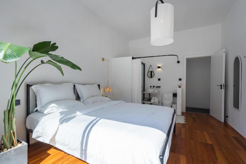 Postel nebo postele na pokoji v ubytování Su Jiu Apartment